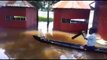 Man rows canoe to local liquor shop during flooding in Kerala
