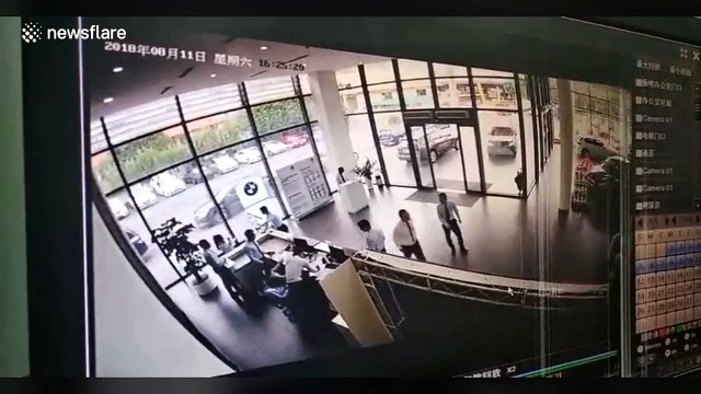 Woman plunges BMW into 4S shop after pressing accelerator by mistake