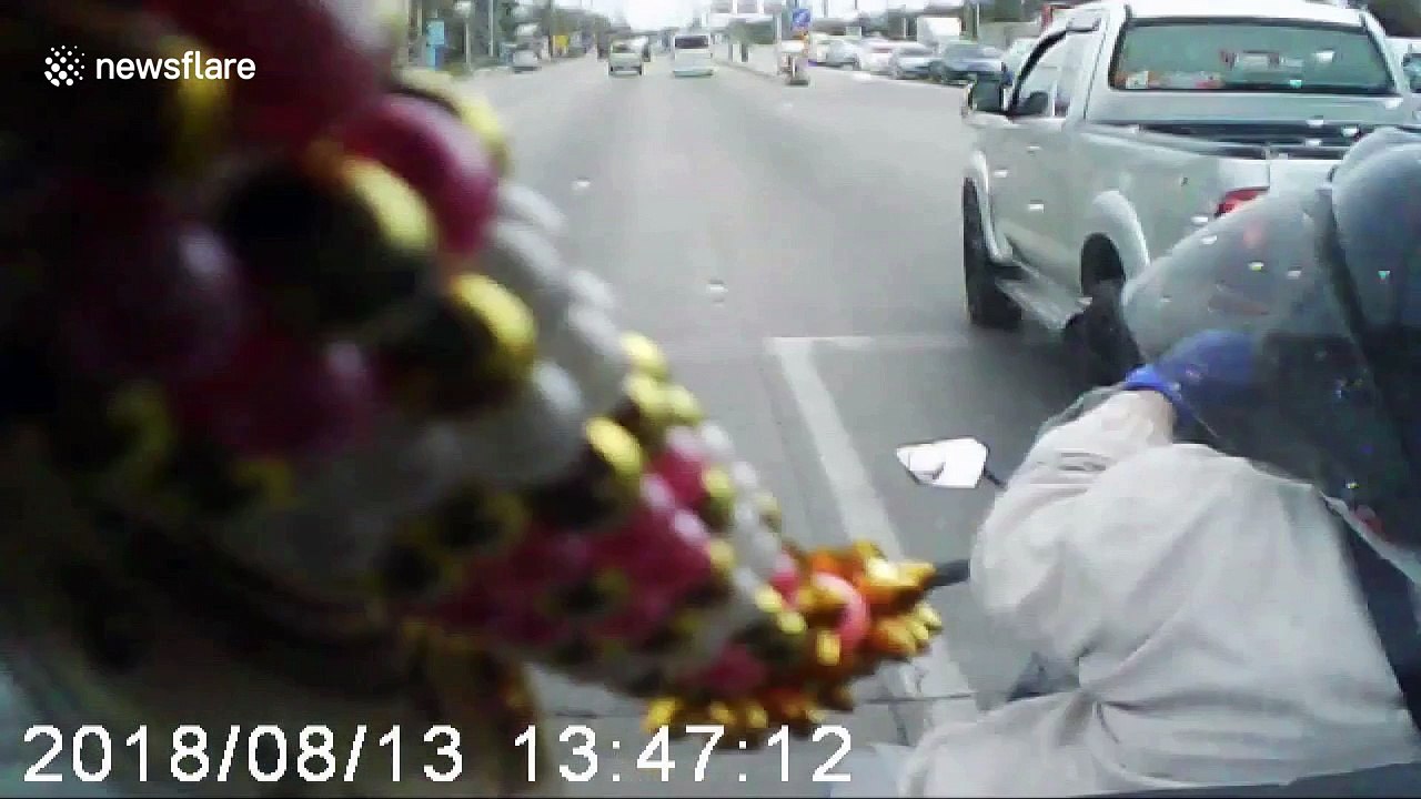 Moped rider crosses lanes without looking and gets clattered by pick-up truck