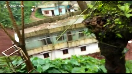 Three-story house slips down hill during landslide
