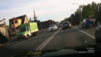 Motorcyclist Has Near Miss with Truck