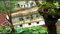 Terrifying moment a house slid down a hill during a landslide