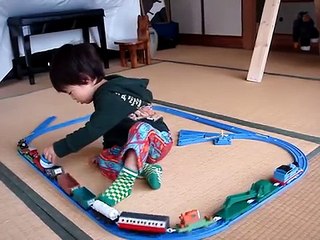 Little boy enjoying with toys