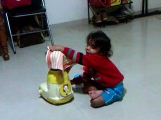 My son operating Mixer grinder without electricity.
