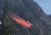 Plane Drops Fire Retardant to Halt Progress of Vancouver Island Fire