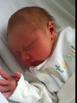 Newborn sneezing so cute!