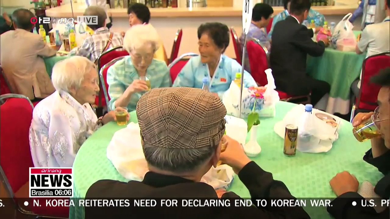 Separated families fromt the two Koreas share memories of the past during their group reunion