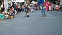 Monkey on chain forced to ride miniature motorbike in Indonesia