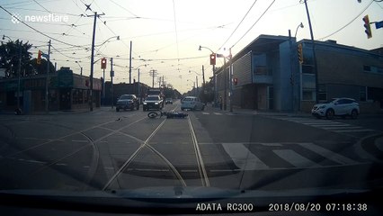 Motorcyclist tumbles into the air after head-on collision with car