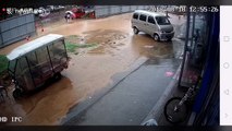Two girls fall into pit covered by floodwater