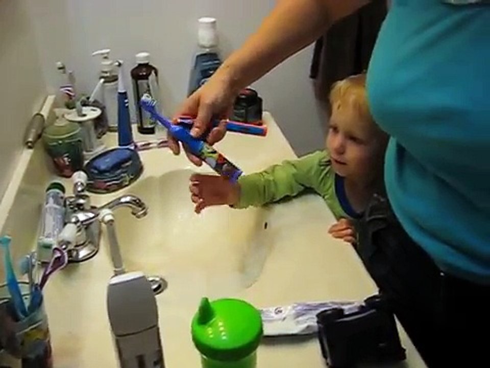 2 Year old kid brushing his teeth