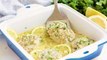 Easy Baked Cod Fish is smothered in a lemon garlic parmesan mixture that makes for a delicious piece of fish.WRITTEN RECIPE: