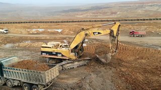 Caterpillar 385B LME Excavator Loading Mercedes Actros And Man Tgs