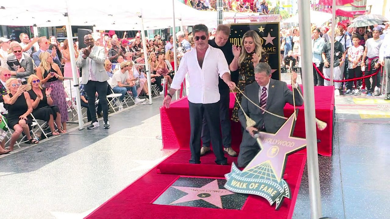 British music mogul Simon Cowell unveils Hollywood star