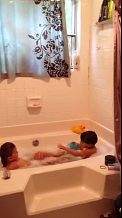 Big brother caught taking care of his baby sister