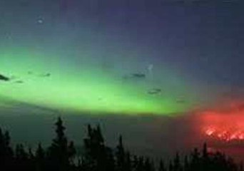 Timelapse Shows Northern Lights Swirl Next to Raging Wildfire in Canada