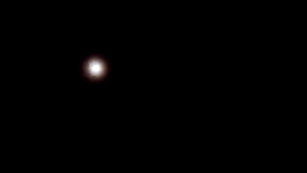 THE MOON IN CLOUDS