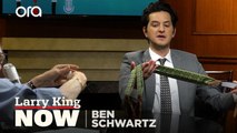 Larry King gifts a pair of his suspenders to Ben Schwartz