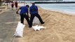 Workers fill up sandbags in Waikiki ahead of Hurricane Lane landfall