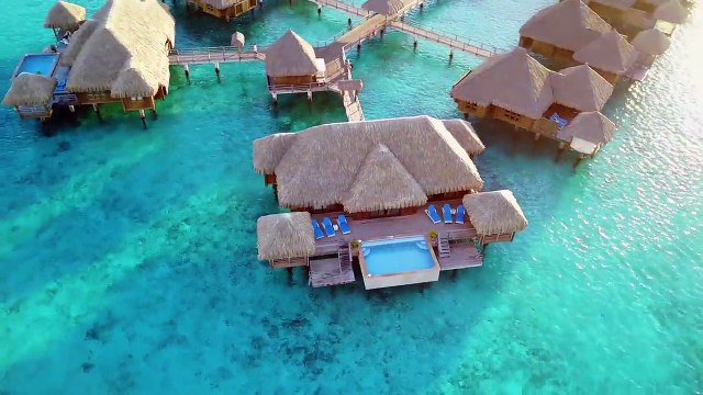Flying over the St Regis Resort luxury overwater bungalow in Bora Bora via incaidgalleries