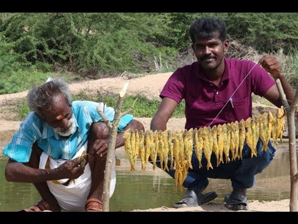 Traditional style fire fish prepared by my daddy / Village food factory
