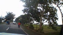 Motorcyclist goes head over handlebars after crashing into the back of minivan