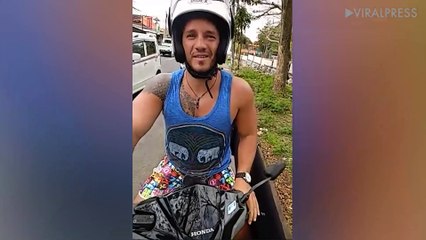 Pavement vigilante confronts people riding on the walkway in Bali