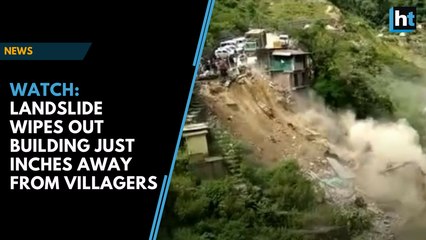 Watch: Landslide wipes out building just inches away from villagers