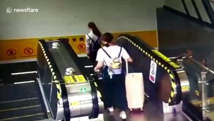 Suitcase tumbles down escalator and wipes out commuters