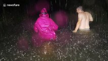 Crazy footage shows residents walking home in waist-deep water as Hurricane Lane nears
