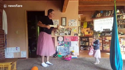 Grandpa dons pink tutu to play guitar and dance with granddaughter