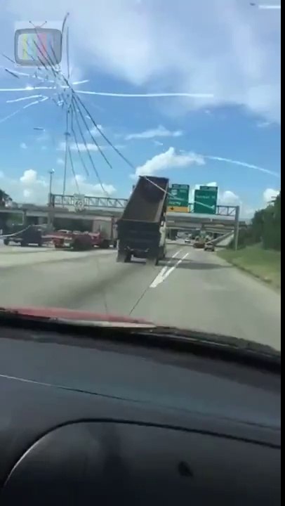 Driver Witnesses Dump Truck Crash Into Highway Sign in Jacinto City, TEXAS