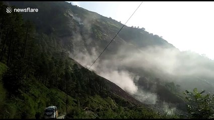 Spectacular shower of boulders bursts down mountainside