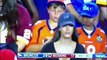 Kid's just enjoying the view at a Broncos game 
