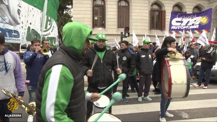 Argentina's Macri raises taxes, axes ministries after peso plunge