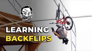 Learning how to backflip my mountain bike | Featuring Skills with Phil