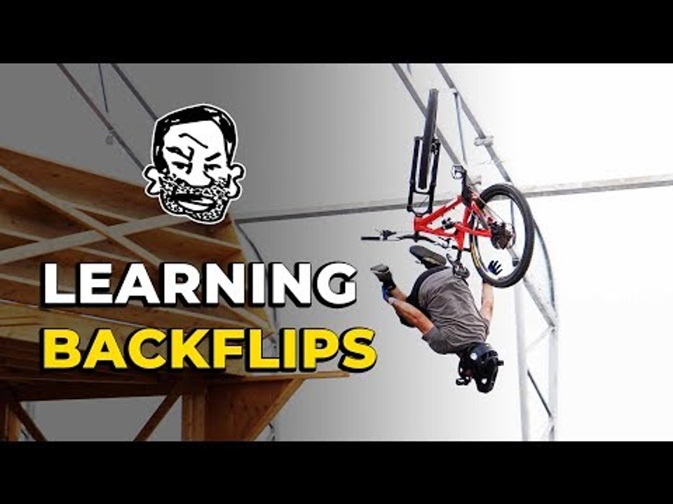 Learning how to backflip my mountain bike | Featuring Skills with Phil