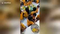 Heartwarming moment big sister feeds little brother on first day at school