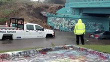 Car Gets Stuck in Floodwaters Under Pensacola's 'Graffiti Bridge'