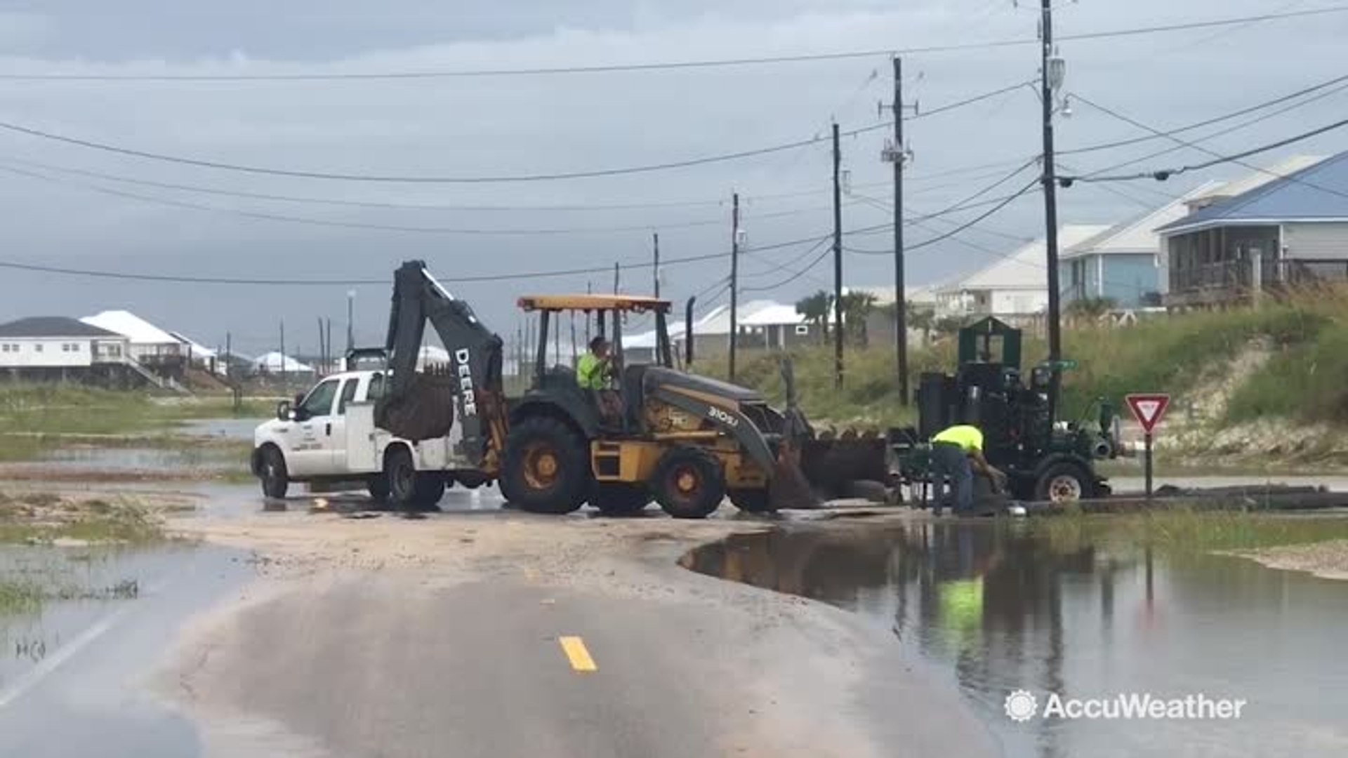 ⁣Floodwaters and sand getting cleared in Dauphin Island, Alabama