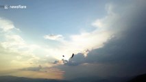 Pro-paraglider's daring 'infinity tumbling' stunt caught on drone camera