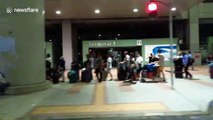 Hours-long wait for stranded passengers and airport employees queueing for shuttle bus out of Kansai Airport island