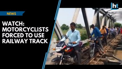 Watch: Motorcyclists  forced to use railway track after rains flood roads in Rajasthan