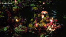 Thai people celebrate annual 'Festival of Lights' by floating lit candles downriver