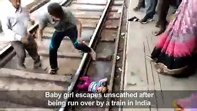 Indian baby survives being run over by train
