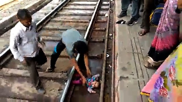 Indian baby survives being run over by train