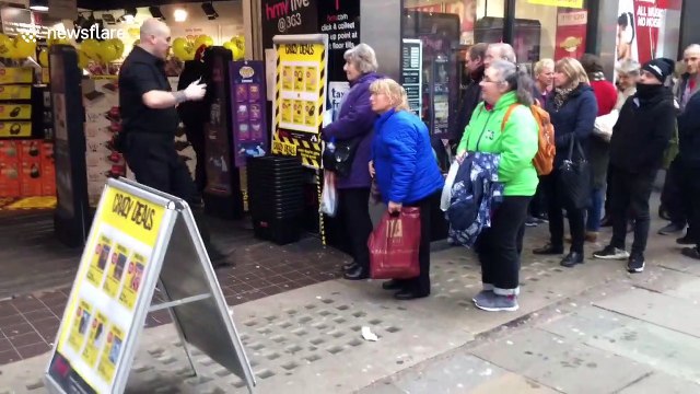 London's Oxford Street looks deserted as just a few senior citizens queue outside HMV