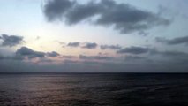 Sunset Sky with Dark clouds in the Ocean