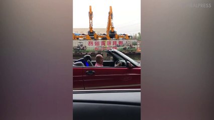 Super-Cool Grandfather In Convertible With Two Huge Speakers