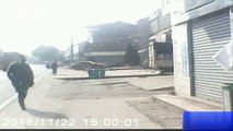 Passerby runs away seconds before warehouse collapses in dramatic crash